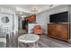 Bright living area adjacent to kitchen with comfortable seating, modern flooring, and TV at 2600 N Ocean Blvd. # 807, Myrtle Beach, SC 29577