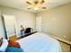 Well-lit bedroom with a ceiling fan, closet, desk and a light colored wood floor at 2604 Willow St., North Myrtle Beach, SC 29582