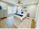 Well-lit bedroom featuring a comfortable bed, stylish decor, and a ceiling fan at 2604 Willow St., North Myrtle Beach, SC 29582
