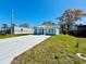 Inviting single-story home showcasing a modern driveway, a light blue facade, and a green lawn at 2604 Willow St., North Myrtle Beach, SC 29582