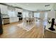 Open-concept living room and kitchen area with a dining table and modern appliances at 2604 Willow St., North Myrtle Beach, SC 29582
