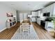 Modern open-concept living space including stainless kitchen appliances and dining area at 2604 Willow St., North Myrtle Beach, SC 29582