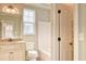Bright bathroom featuring a granite-topped vanity, a commode, and a shower-tub combo at 2935 Moss Bridge Ln., Myrtle Beach, SC 29579
