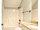 Inviting bathroom featuring a tub-shower combo, stone countertop vanity, and bronze fixtures at 2935 Moss Bridge Ln., Myrtle Beach, SC 29579