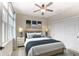 Serene bedroom with stylish decor, large bed, ceiling fan, and natural light at 2935 Moss Bridge Ln., Myrtle Beach, SC 29579