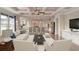 Inviting living room with a coffered ceiling, an open floor plan, and hardwood flooring with modern decor at 2935 Moss Bridge Ln., Myrtle Beach, SC 29579