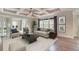 Elegant living room with coffered ceilings, designer furniture, and large windows for abundant natural light at 2935 Moss Bridge Ln., Myrtle Beach, SC 29579