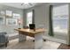 Bright office featuring modern decor, a laptop on the desk, and natural light from the multiple windows at 2935 Moss Bridge Ln., Myrtle Beach, SC 29579
