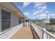 Spacious balcony with beautiful views of the neighborhood street and surrounding homes at 301 58Th Ave. N, North Myrtle Beach, SC 29582