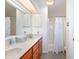 Bathroom featuring double sinks, new cabinets, and a bathtub with shower at 301 58Th Ave. N, North Myrtle Beach, SC 29582