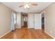 A bedroom with wood floor, a fan on the ceiling and a window with blind at 301 58Th Ave. N, North Myrtle Beach, SC 29582