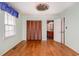 Bright bedroom features wood floors, updated ceiling fan, and a large window for natural light at 301 58Th Ave. N, North Myrtle Beach, SC 29582