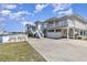 Charming two-story home with a balcony, outdoor storage, and ample parking space at 301 58Th Ave. N, North Myrtle Beach, SC 29582