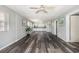 Open-concept living area boasts modern floors, natural light, and seamless flow to kitchen at 301 58Th Ave. N, North Myrtle Beach, SC 29582