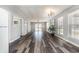 Spacious living room with modern flooring, bright windows, and access to the outdoors at 301 58Th Ave. N, North Myrtle Beach, SC 29582
