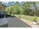 Stone patio leading to large backyard with landscaped greenery at 320 Cog Hill Ct., Murrells Inlet, SC 29576