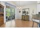 An elegant dining area featuring a chandelier, and a glass door leading to an outdoor space at 320 Cog Hill Ct., Murrells Inlet, SC 29576