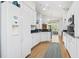 Bright kitchen with white cabinets, granite countertops, and modern appliances at 320 Cog Hill Ct., Murrells Inlet, SC 29576