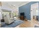 Inviting living room with comfortable seating, blue accent wall, and open floor plan at 320 Cog Hill Ct., Murrells Inlet, SC 29576
