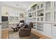 Cozy living room featuring built-in shelving, natural light and comfortable seating at 320 Cog Hill Ct., Murrells Inlet, SC 29576