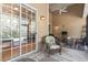 Covered back porch with wicker furniture and view of backyard at 320 Cog Hill Ct., Murrells Inlet, SC 29576