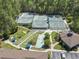 This aerial shot showcases community tennis and bocce ball courts with a clubhouse at 320 Cog Hill Ct., Murrells Inlet, SC 29576