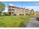 An exterior view of a tan apartment complex with green lawns at 380 Myrtle Greens Dr. # D, Conway, SC 29526