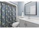 Full bathroom featuring large vanity, floral shower curtain, and neutral colors at 404 75Th Ave. N # E, Myrtle Beach, SC 29572