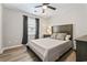 Bedroom with hardwood floors, overhead fan, and natural light at 404 75Th Ave. N # E, Myrtle Beach, SC 29572