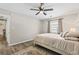 Bedroom with hardwood floors, overhead fan, and lots of natural light at 404 75Th Ave. N # E, Myrtle Beach, SC 29572
