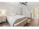 Bedroom with a queen-sized bed, hardwood floors, a ceiling fan, and a dresser at 404 75Th Ave. N # E, Myrtle Beach, SC 29572
