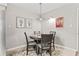 Cozy dining area with a round table, four chairs, and decorative artwork at 404 75Th Ave. N # E, Myrtle Beach, SC 29572