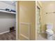 Hallway leading to the closet and bathroom featuring warm yellow walls at 404 75Th Ave. N # E, Myrtle Beach, SC 29572