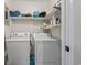 Laundry room with washer, dryer, shelving, and other essential cleaning supplies at 404 75Th Ave. N # E, Myrtle Beach, SC 29572