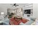 Comfortable living room with a ceiling fan, modern furniture, and a decorative rug at 404 75Th Ave. N # E, Myrtle Beach, SC 29572