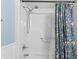 Full bath with shower head and floral shower curtain at 404 75Th Ave. N # E, Myrtle Beach, SC 29572