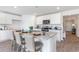 Eat-in kitchen featuring white cabinets, a granite island, and bar stool seating at 417 Flank St., Myrtle Beach, SC 29588