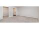 A neutral bedroom leads to both a walk-in closet and a bathroom with a toilet and sink at 425 Flank St., Myrtle Beach, SC 29588