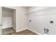 Walk-in closet with wood flooring, wire shelving, washer hookups, and electrical outlet at 425 Flank St., Myrtle Beach, SC 29588
