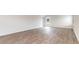 Spacious living area with durable flooring and a view of the backyard through a glass door, ideal for indoor-outdoor living at 425 Flank St., Myrtle Beach, SC 29588