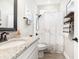 Bathroom featuring shower with marble-patterned curtain and granite countertop at 480 N Boundaryline Dr. Nw, Calabash, NC 28467