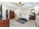 Comfortable bedroom with tray ceiling, hardwood floors, and dressers at 480 N Boundaryline Dr. Nw, Calabash, NC 28467
