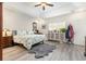 Bright bedroom featuring hardwood floors, tray ceiling, and dresser at 480 N Boundaryline Dr. Nw, Calabash, NC 28467