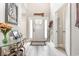 Bright entryway with tall ceilings, light gray wood flooring, and decorative accents enhancing its appeal at 480 N Boundaryline Dr. Nw, Calabash, NC 28467