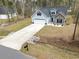 Charming two-story home with a well-manicured lawn and attached garage, showcasing great curb appeal at 480 N Boundaryline Dr. Nw, Calabash, NC 28467