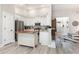 Spacious kitchen with white cabinets, stainless steel appliances, and hardwood island at 480 N Boundaryline Dr. Nw, Calabash, NC 28467