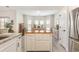 Open kitchen and dining area with center island, granite countertops, and modern cabinets at 480 N Boundaryline Dr. Nw, Calabash, NC 28467
