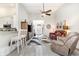 Open living room with luxury vinyl plank flooring, a ceiling fan, and seamless flow into other living spaces at 480 N Boundaryline Dr. Nw, Calabash, NC 28467