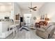 Open living room with luxury vinyl plank flooring, a ceiling fan, and seamless flow into other living spaces at 480 N Boundaryline Dr. Nw, Calabash, NC 28467