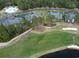 Aerial view of a condo building located next to a golf course at 524 Pinehurst Ln. # 19D, Pawleys Island, SC 29585